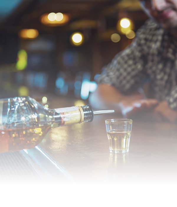 Alcohol being poured at a bar