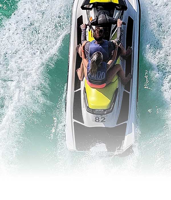 couple riding jet ski in ocean