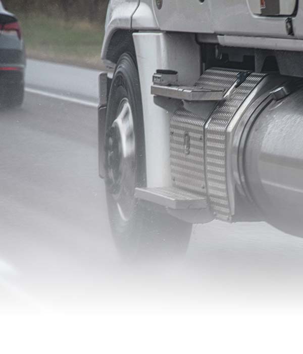 semi truck driving down road