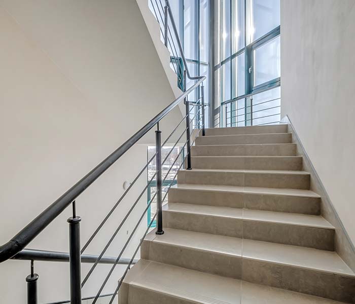 office stairway with loose handrail