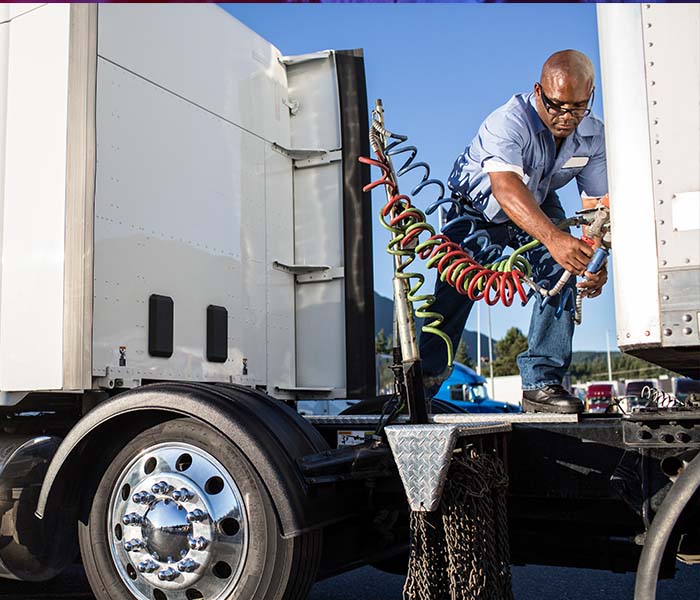 truck driver hooking up semi